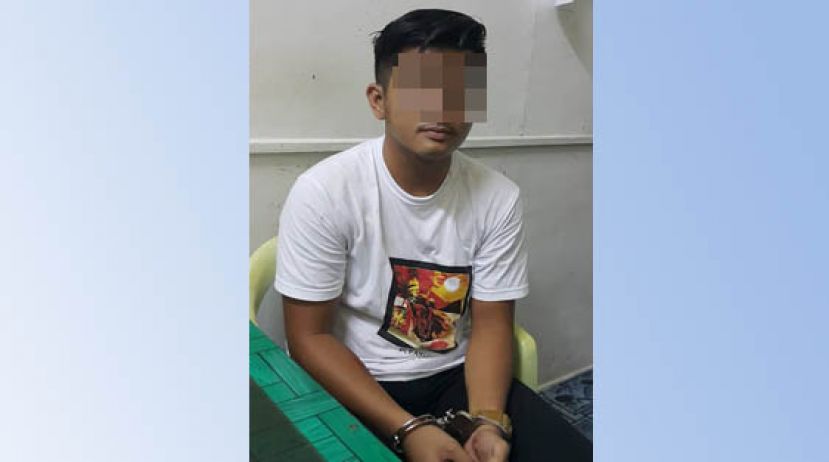 落网嫌犯被带回警局查办。