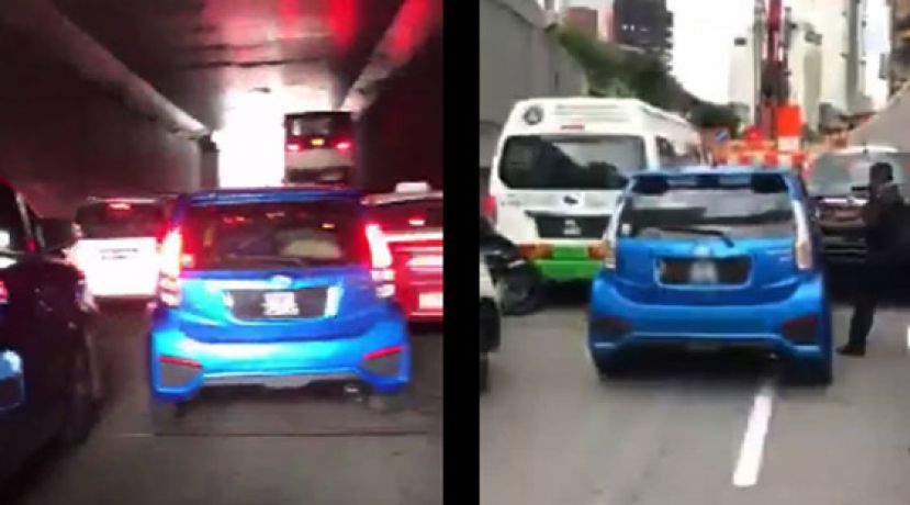 轿车在繁忘车道内&ldquo;硬挤&rdquo;，路人阻止不遂。